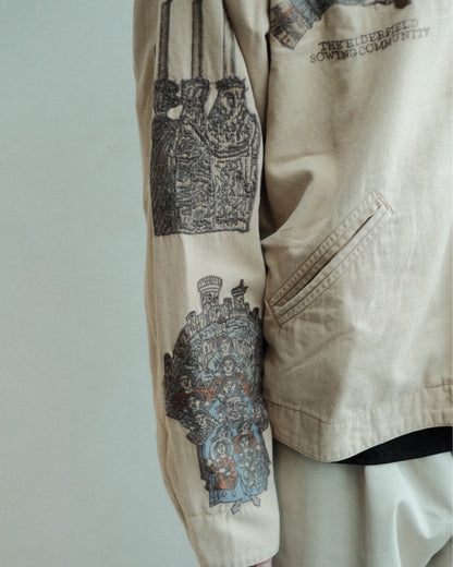 SAMUEL ZELIG Elder Work Jacket Pale Khaki EL-FW26-18-CAN 袖の燭台・人物刺繍と腰ポケットの詳細